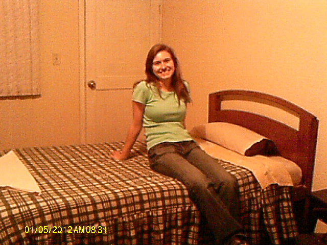 Rachel on bed in hotel